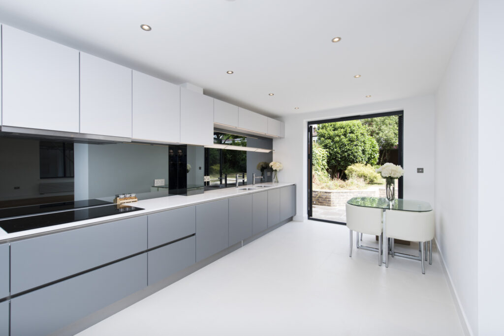 Fitted kitchen with full length glass panel